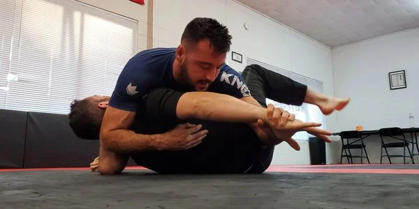 Tap Em Out Jujitsu academy logo