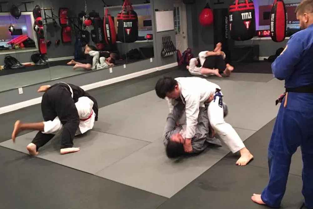 Amped Mixed Martial Arts academy logo