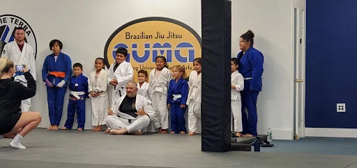 Grappling University Martial Arts (GUMA) academy logo